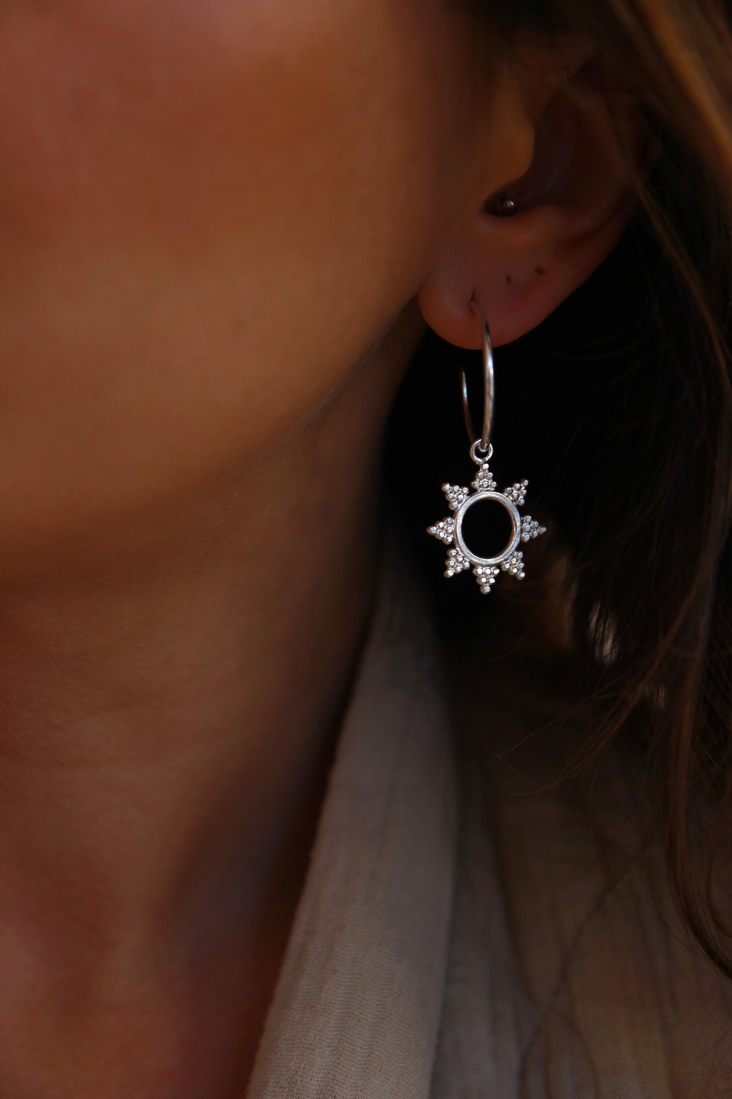 Silver sun earrings